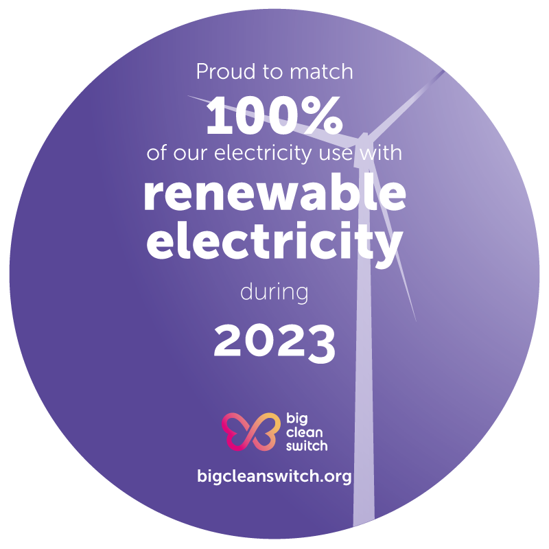 Purple circular logo, stating in white lettering that ADCL is proud to have been powered 100% by renewable electricity again in 2023
